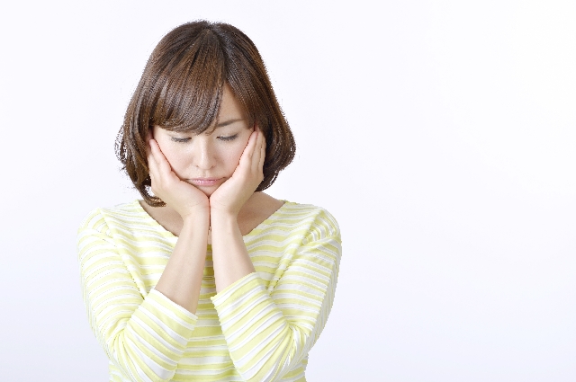 体調がわるい女性